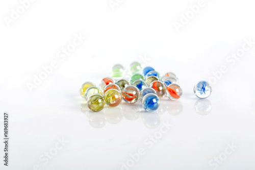 glass marbles balls on white background ,selective focus
