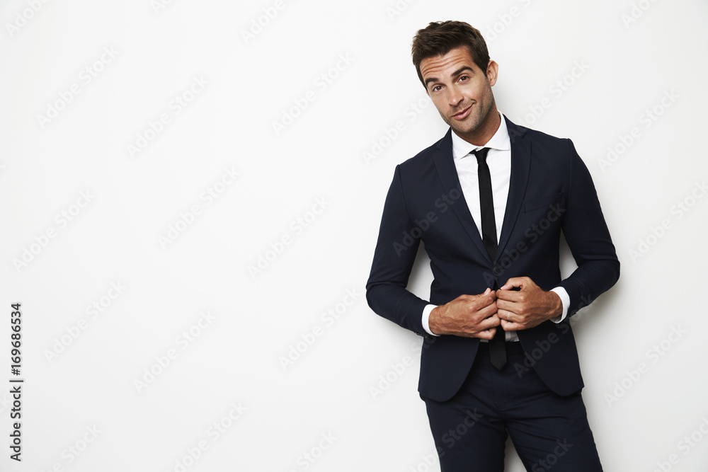 Handsome dude in business suit in white studio Handsome dude in business suit in white studio