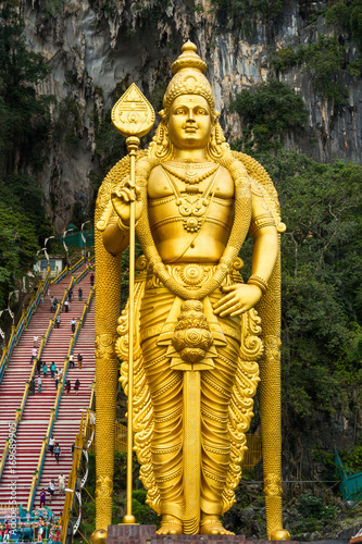 Golden Statue of Shiva and stairs in Batu cave, Malaysia