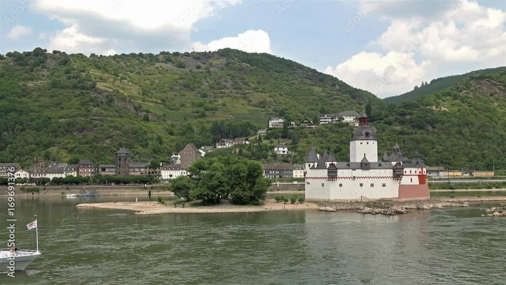 Passenger ship passing the village of Kaub skyline with castle Pfalzgrafenstein, Unesco world heritage site Passenger ship passing the village of Kaub skyline with castle Pfalzgrafenstein, Unesco world heritage site