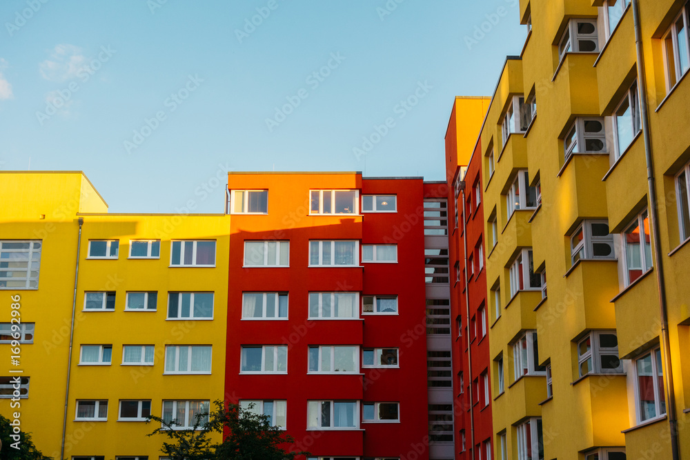 yellow and red colored houses in a big living complex