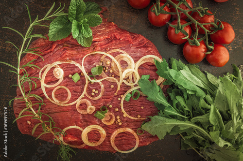 Flankensteak ,zum grillen oder braten vorbereitet mit Gewürzen  photo