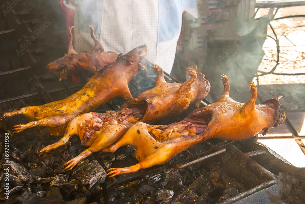 Cuy a la brasa. Ecuador. Grilled guinea pig on charcoal. Fried Kui.  National food of Ecuador. Stock Photo | Adobe Stock