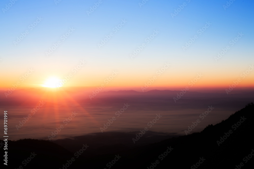 sun rise over a fog and mountain  in Thailand
