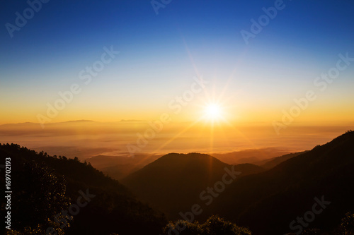 sun rise over a fog and mountain in Thailand