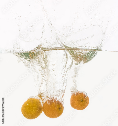 Fruits throwing into the water