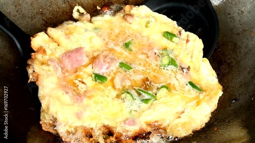 fryin omelet in pan photo