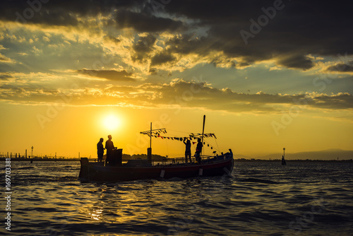 Sea sunset image. silhouette of the boat on summer sunset background.