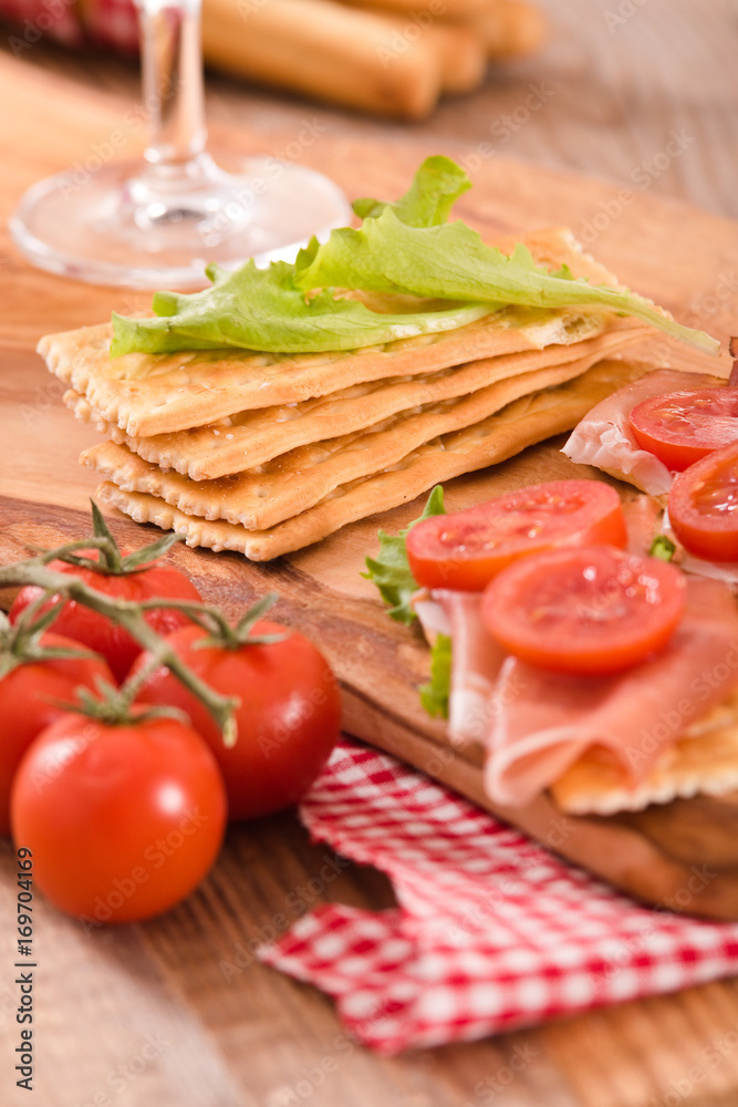Crackers with ham and avocado. Crackers with ham and avocado.
