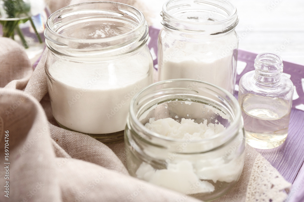 Jars with ingredients for deodorant on table, closeup Jars with ingredients for deodorant on table, closeup