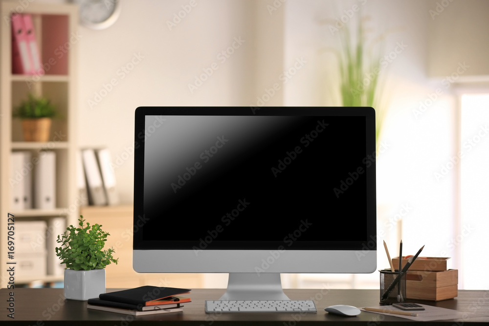 Comfortable workplace with modern monitor on table Comfortable workplace with modern monitor on table