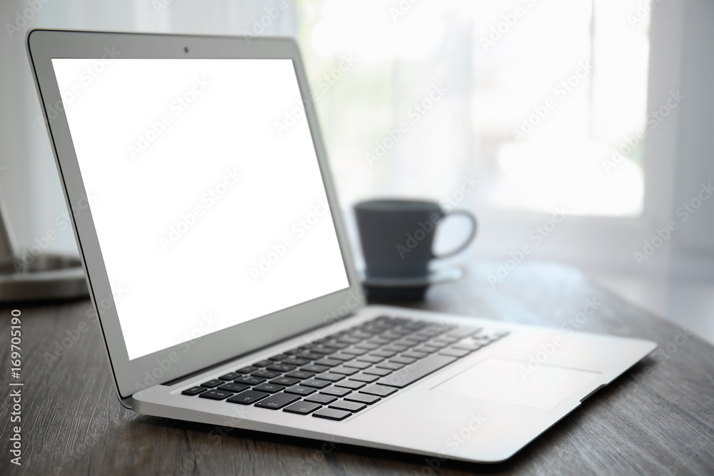 Fototapeta premium Comfortable workplace with modern laptop on table