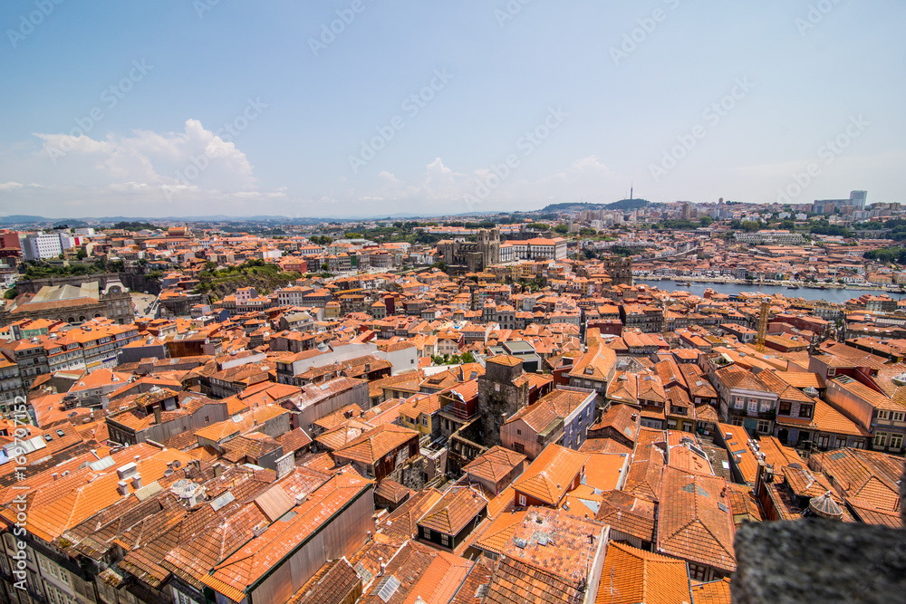 Porto, Portugal - July 2017. Colored facades and roofs of houses in Porto, Portugal. Porto is one of the most popular tourist destinations in Europe.