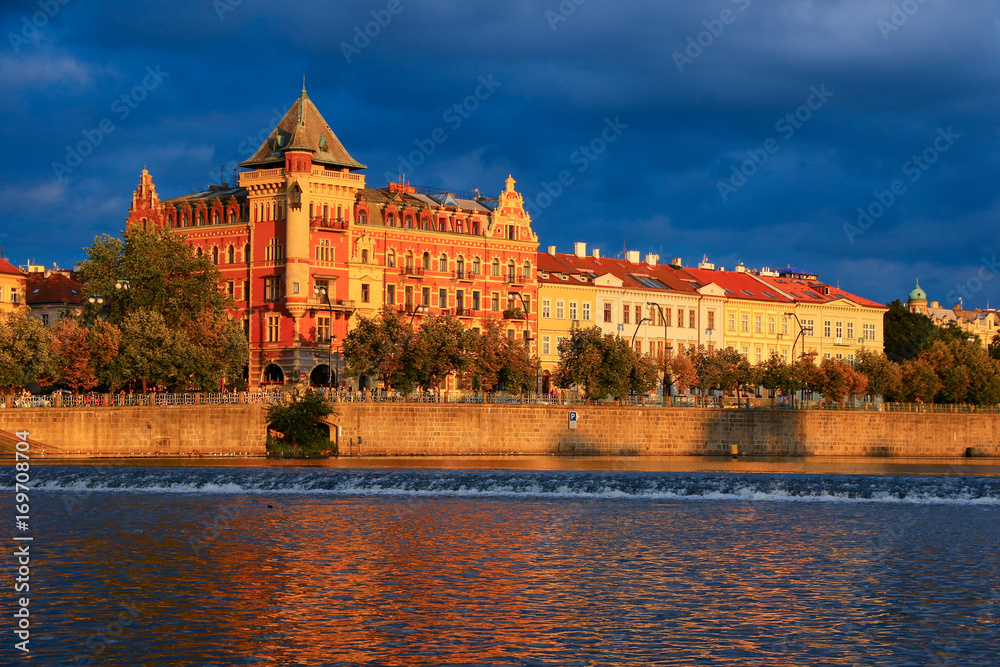 Reflections on the Vltava river at sunset in Prague city center