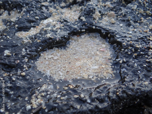 heart shaped stone with sand inside
