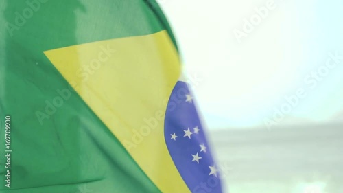 Brazilian flag waving in the wind in slow motion in Rio De Janeiro, Brazil