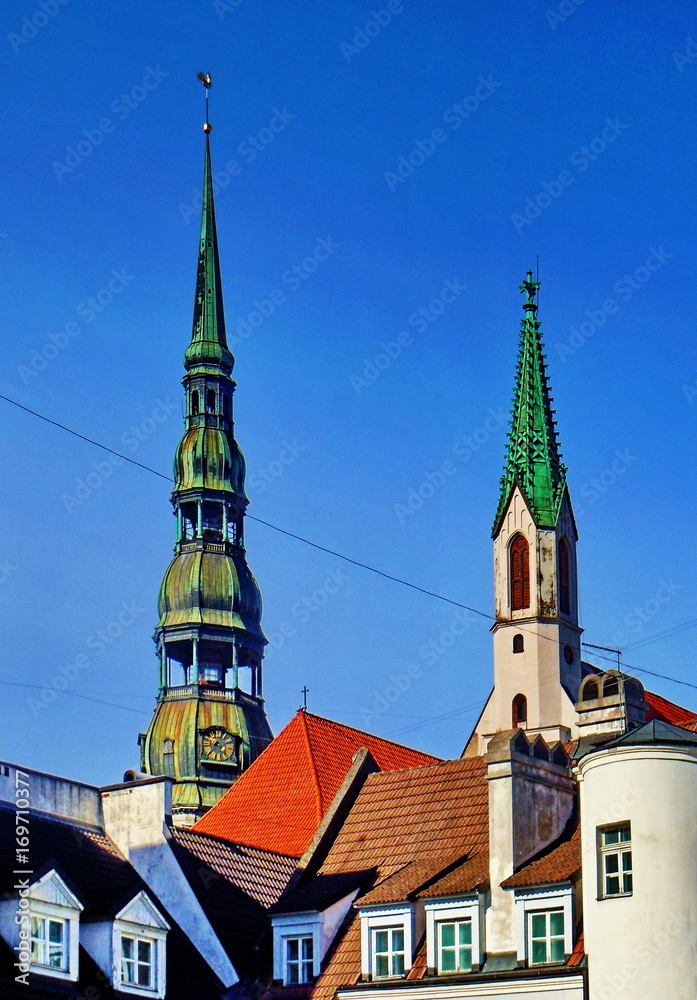 Obraz premium Roofs, dormers and church towers (Old Riga, Latvia)