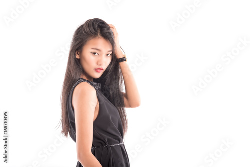 Portrait of a smiling brunette asian woman .Beautiful sexy female model posing isolated on white