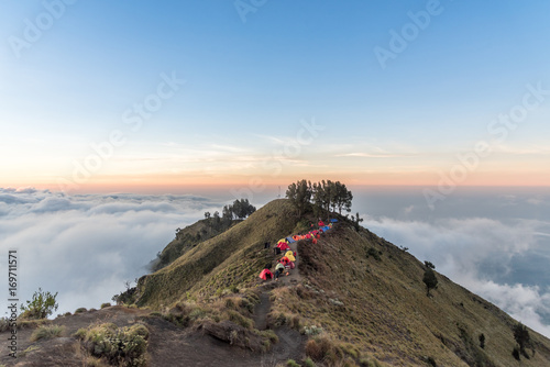 Camping site on crater rim of Mount Rinjani at sunset. Lombok Island, Indonesia. photo