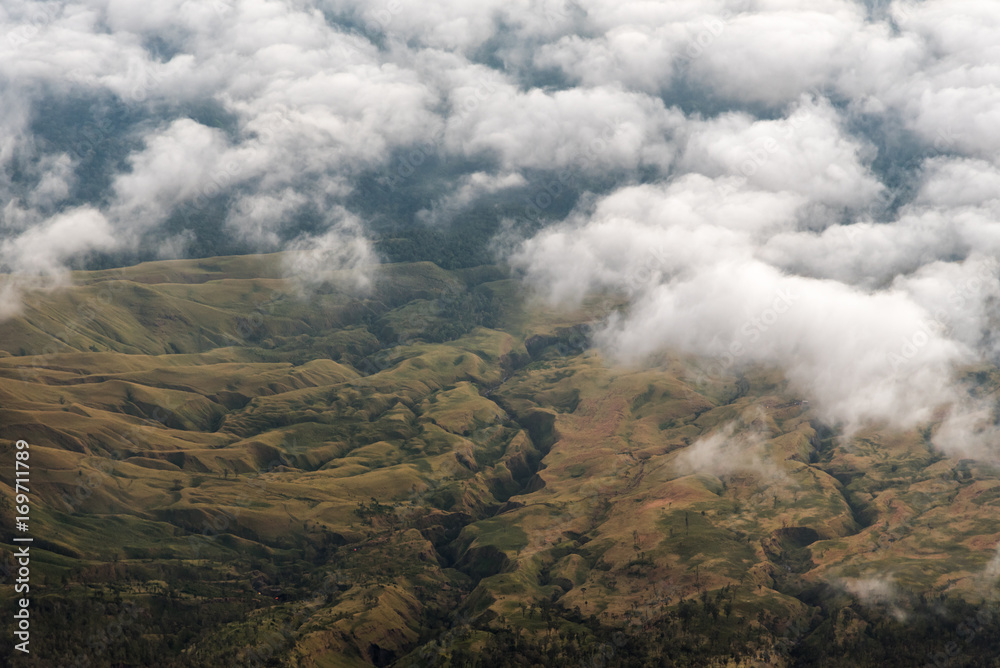 Aerial view of mountain valley on morning from summit of Mount Rinjani. Lombok island, Indonesia.