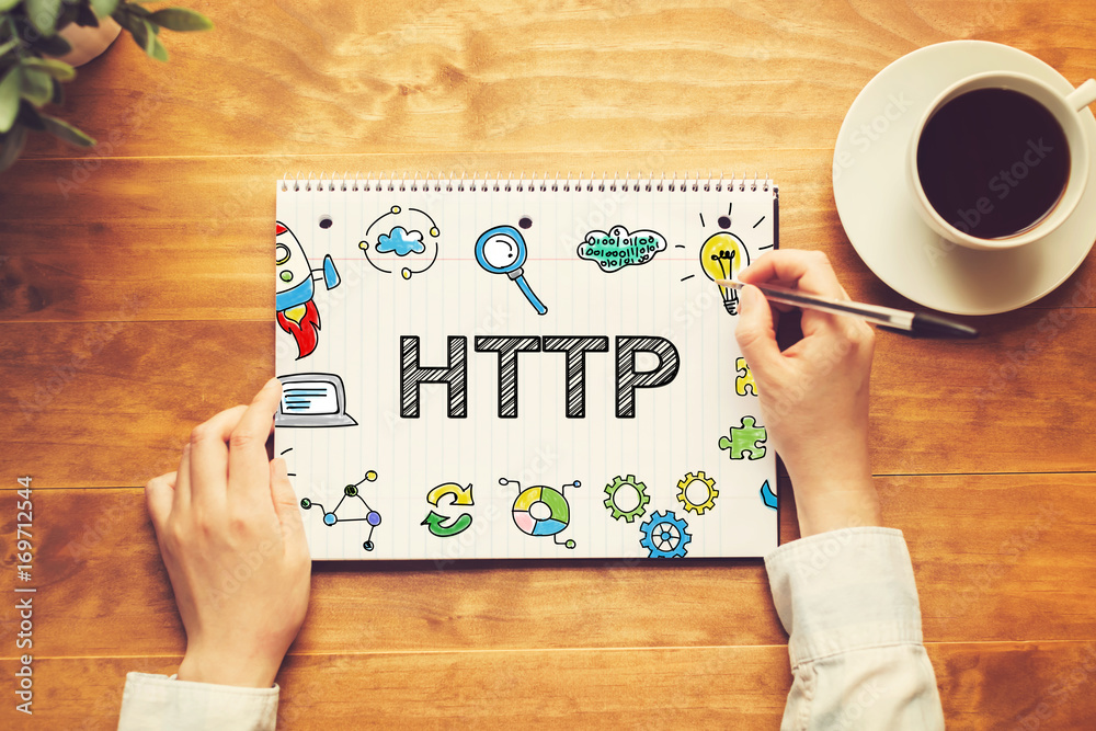 HTTP text with a person holding a pen on a wooden desk HTTP text with a person holding a pen on a wooden desk