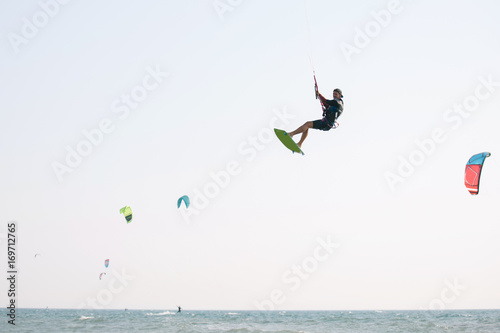 Kiteboarder athlete performing kiteboarding kitesurfing tricks unhooked