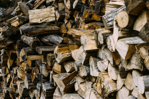 Firewood, wooden background