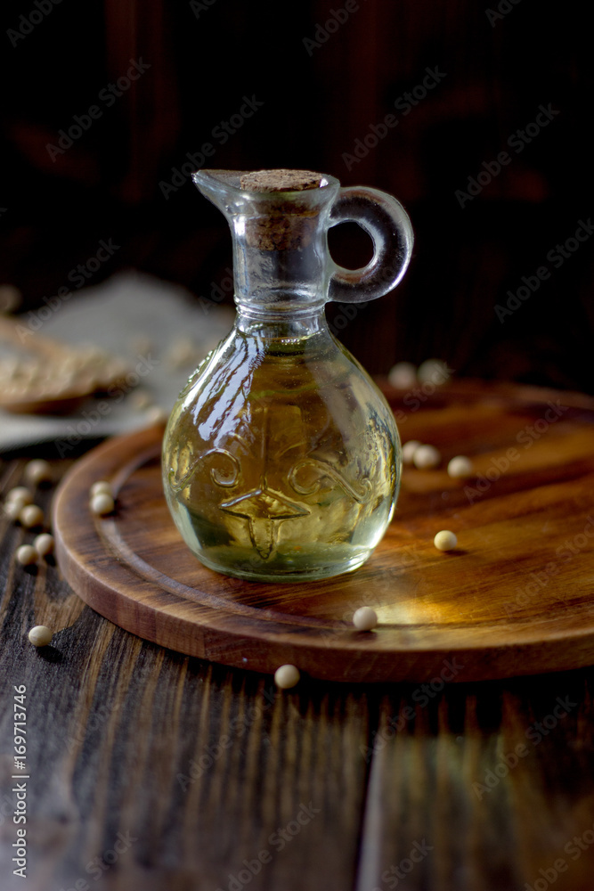 Natural and organic soybean oil with soy beans around it. Natural and organic soybean oil with soy beans around it.