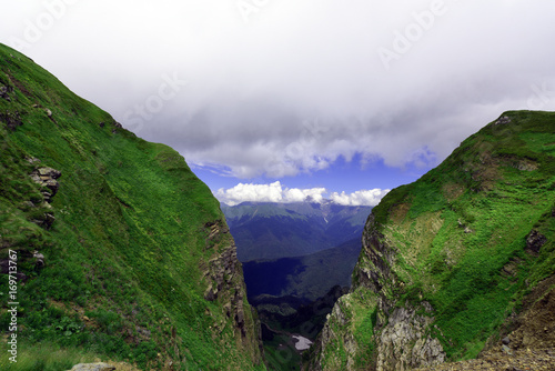 Mountain gorge covered with thick fog