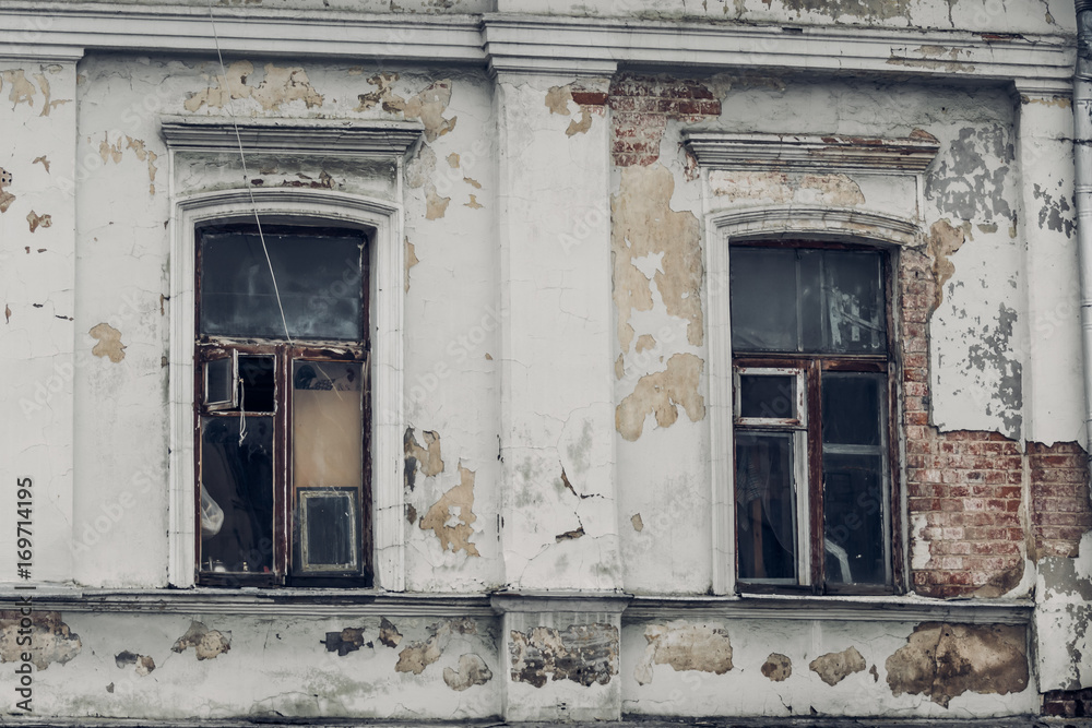 Demolishing windows of an old brick house