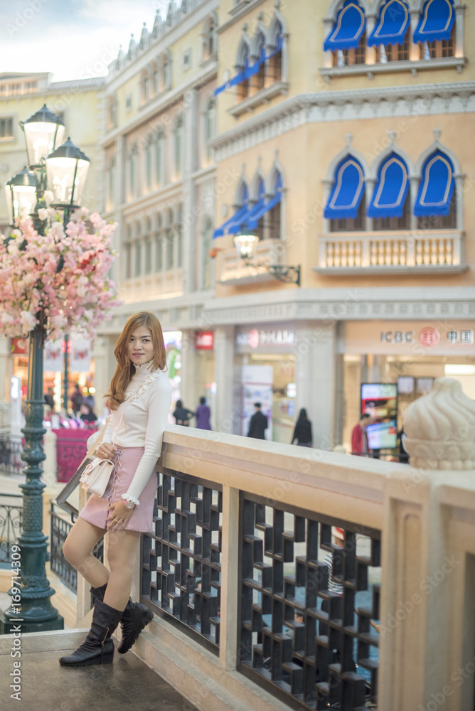 Thai girls go sightseeing and take a photo in Macau.