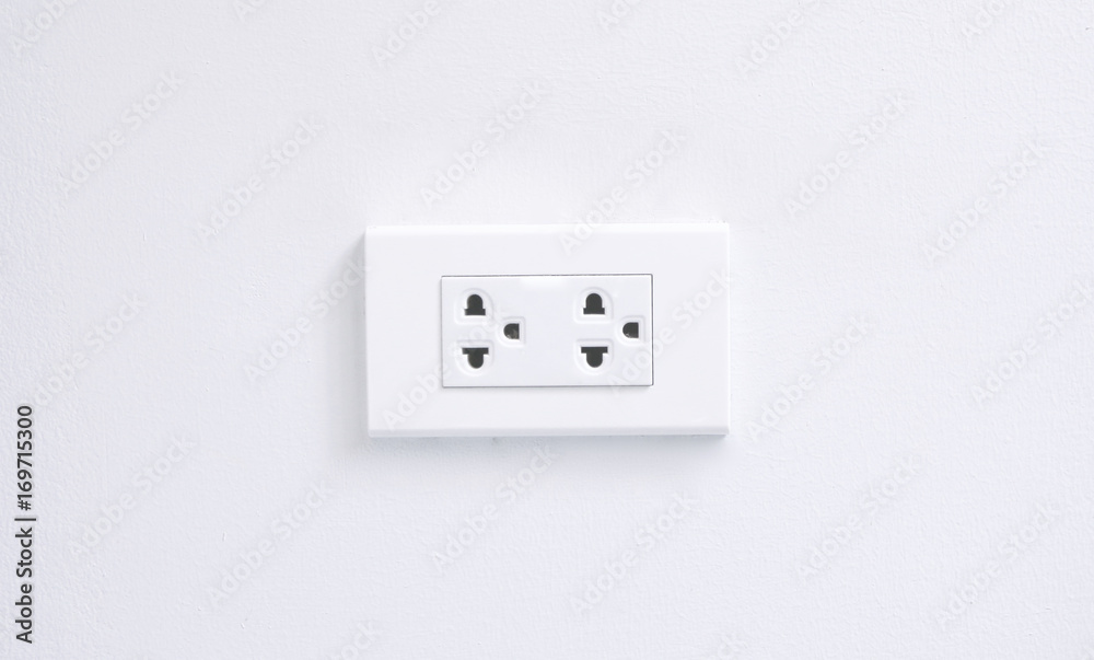 electric plugs on white wall electric plugs on white wall