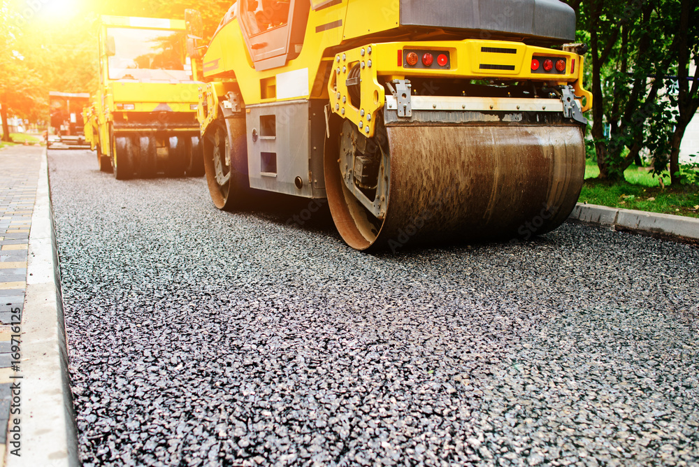 Background of asphalt roller that stack and press hot asphalt. Road repair machine