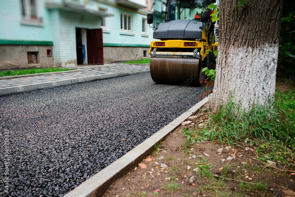 Background of asphalt roller that stack and press hot asphalt. Road repair machine