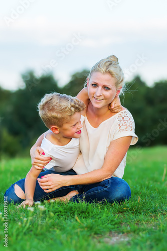 Wallpaper Mural woman romps with her son on the grass Torontodigital.ca