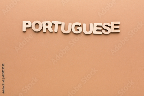 Word Portuguese on beige background