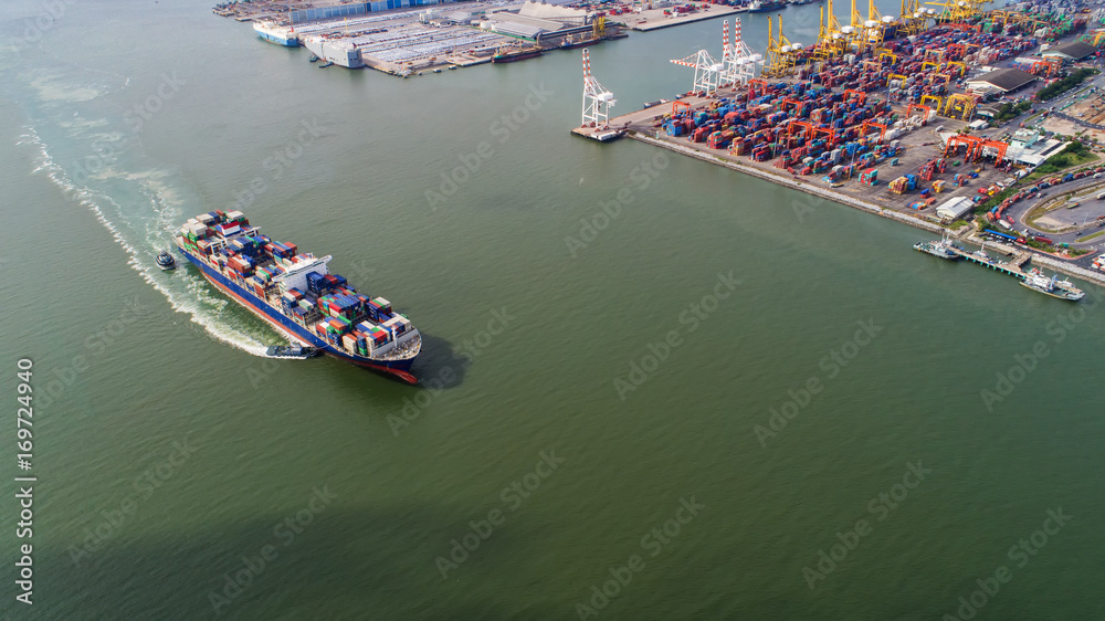 Fototapeta premium container,container ship in import export and business logistic,By crane,Trade Port , Shipping,cargo to harbor.Aerial view,Water transport,International,Shell Marine,transportation,logistic,trade,port