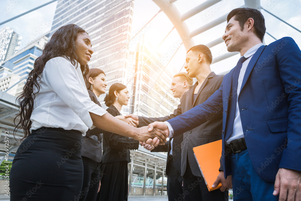 hand shake of team from business peoples after agreement hand shake of team from business peoples after agreement