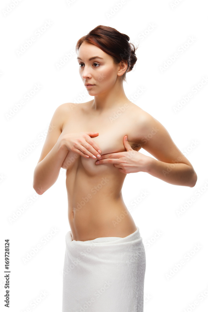 Woman examining her breast isolated on white background Woman examining her breast isolated on white background