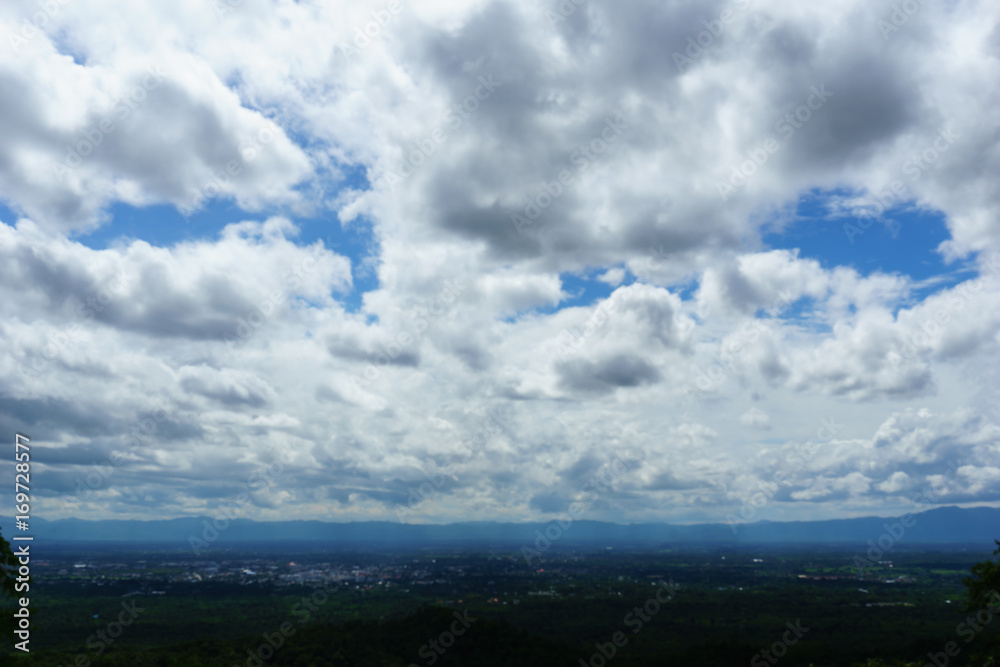 blue cloudy sky over the city. view from the top of mountain blue cloudy sky over the city. view from the top of mountain