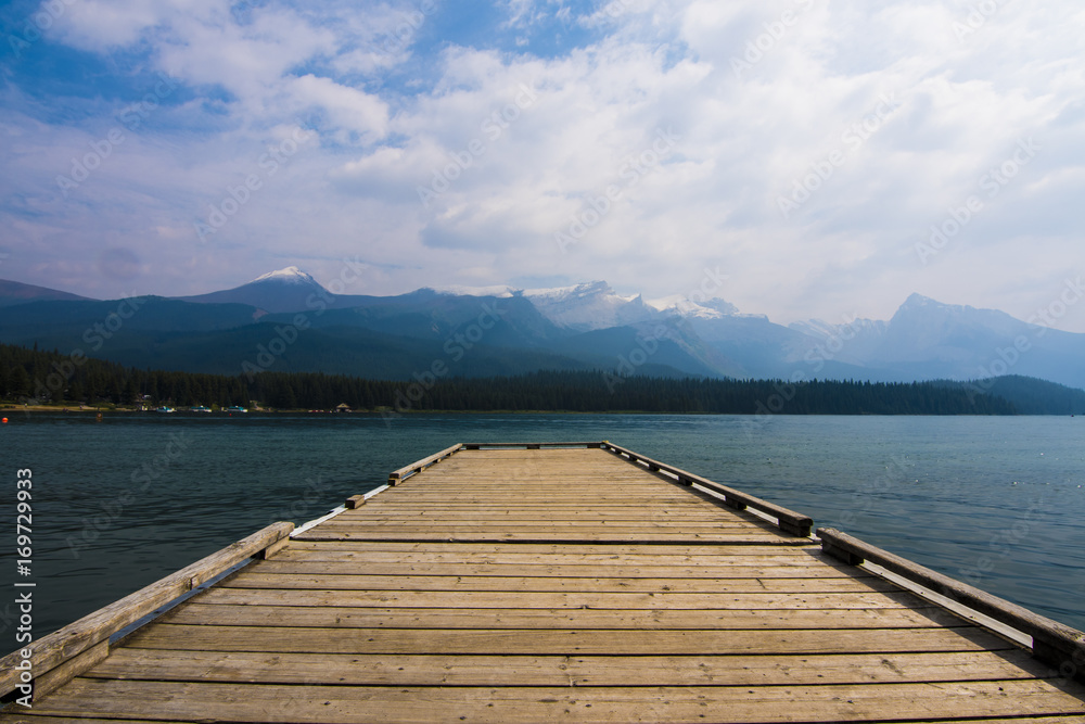 a dock at a mountain lake in canada