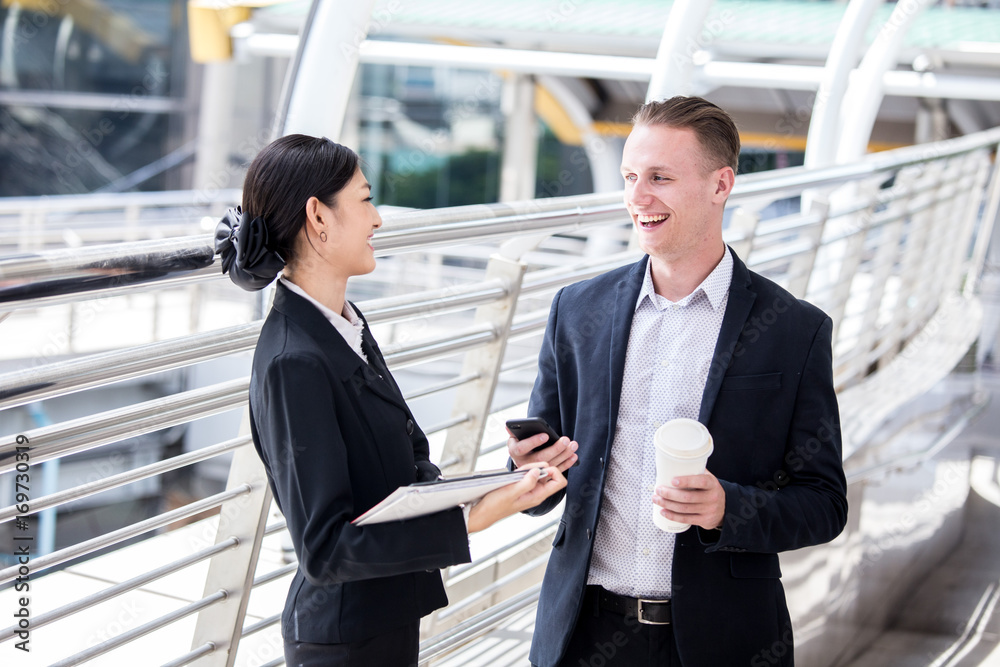 Happy Businessman interesting for Present Project with Businesswoman. People Working at outdoor place. People Working Concept. Happy Businessman interesting for Present Project with Businesswoman. People Working at outdoor place. People Working Concept.