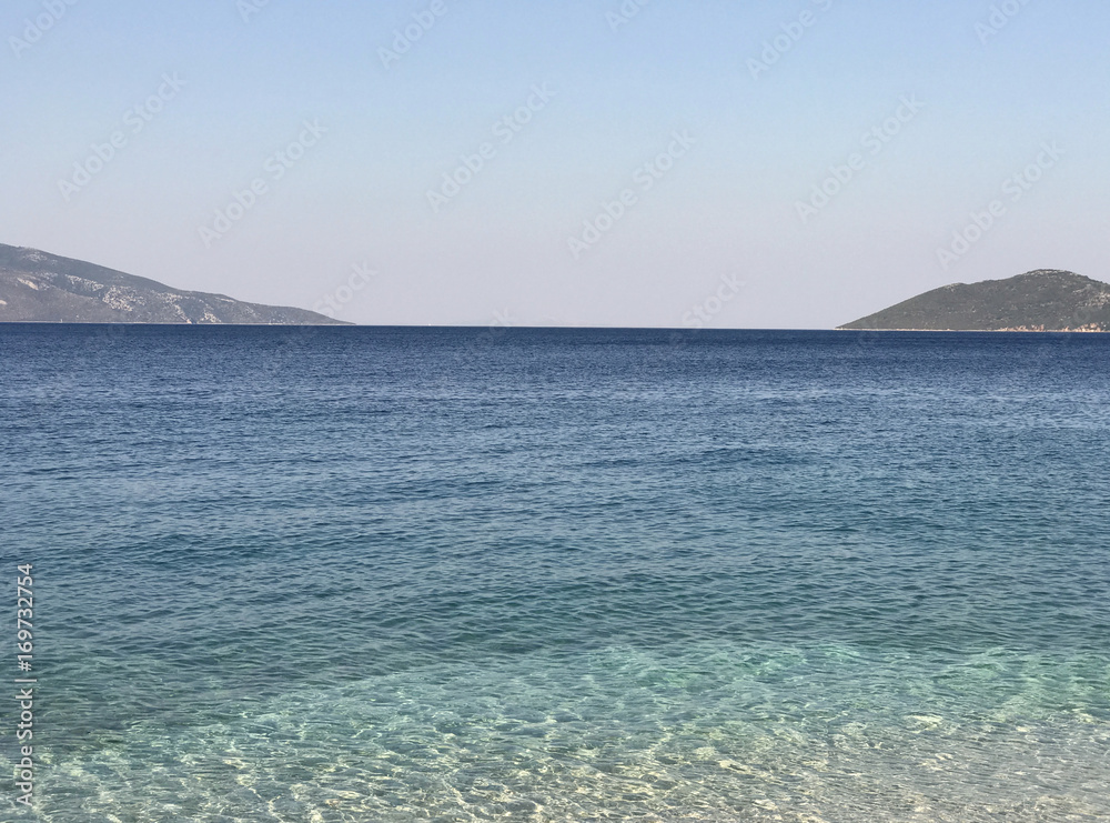 The turquoise and transparent sea of the coast of Kefalonia in Greece.