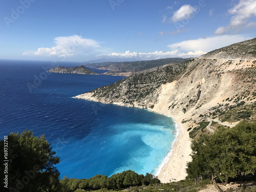 View of the bay of Myrtos beach between mountains with its white sand and turquoise sea, in the coast of Cephalonia or Kefalonia in Greece
