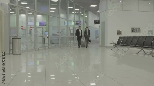 Wallpaper Mural Businesspeople walk in the airport hall Torontodigital.ca