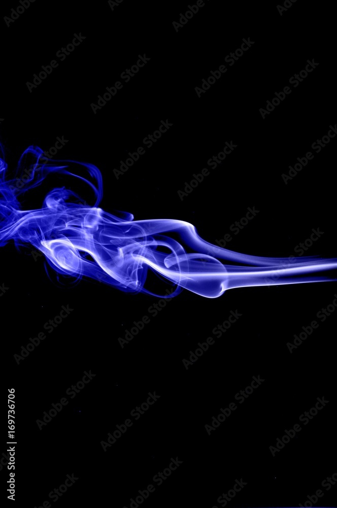 Plakat Abstract blue smoke on black background,blue ink background