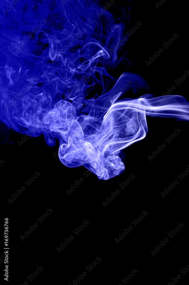 Abstract blue smoke on black background,blue ink background Abstract blue smoke on black background,blue ink background