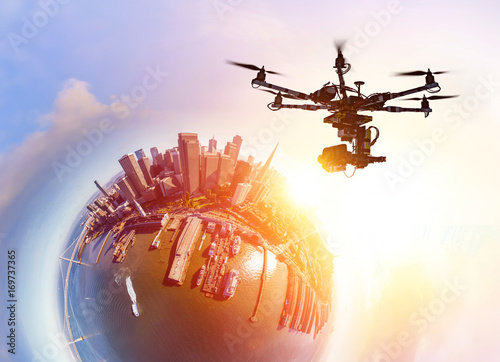Innovation photography concept. Drone flying over San-Francisco city at sunset. Little planet effect. Heavy lift drone photographing city at sunset.