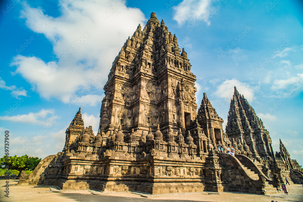 Prambanan or Candi Rara Jonggrang is a Hindu temple compound in Java, Indonesia, dedicated to the Trimurti: the Creator (Brahma), the Preserver (Vishnu) and the Destroyer (Shiva) - obrazy, fototapety, plakaty 