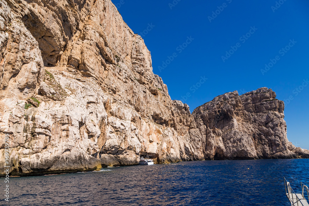 Sardinia, Italy. The excursion boat enters the grotto of Neptune